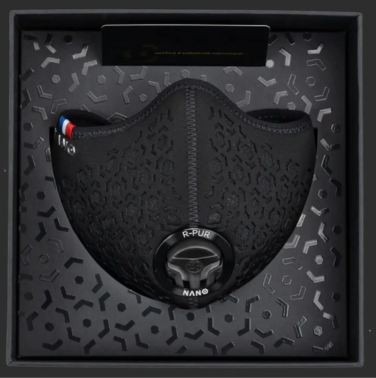 Black R-PUR mask presented inside a patterned retail box, valve and logo visible