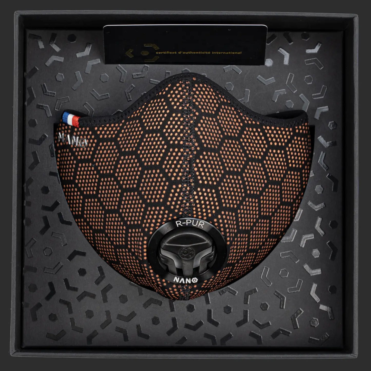 R-PUR orange mask presented inside its black box with certificate card and hex-pattern lining.